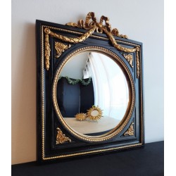 Miroir de sorcière dans cadre noir et détails or style empire