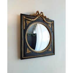 Miroir de sorcière dans cadre noir et détails or style empire